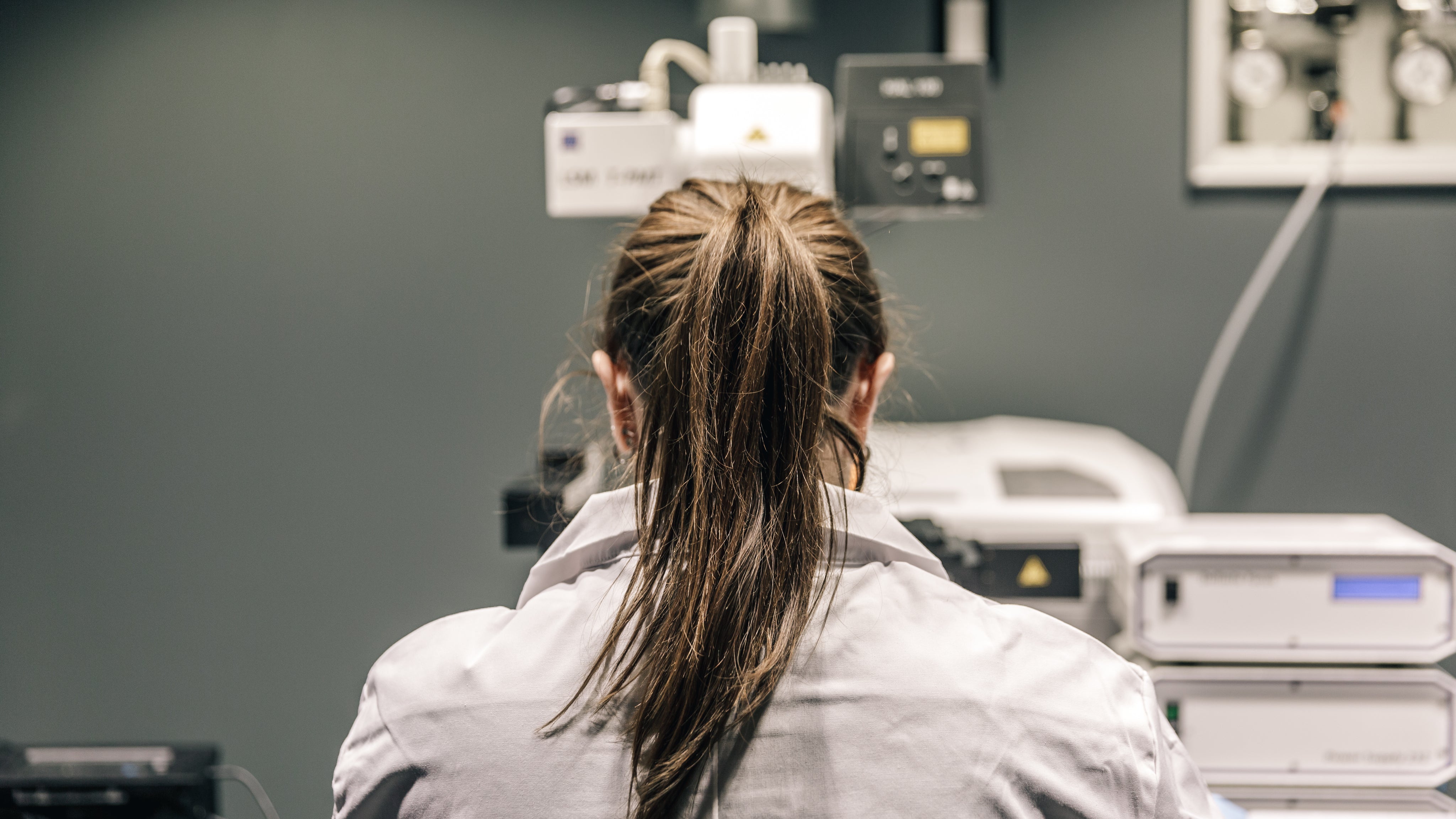 female-scientist-looking-through-microscope.jpg