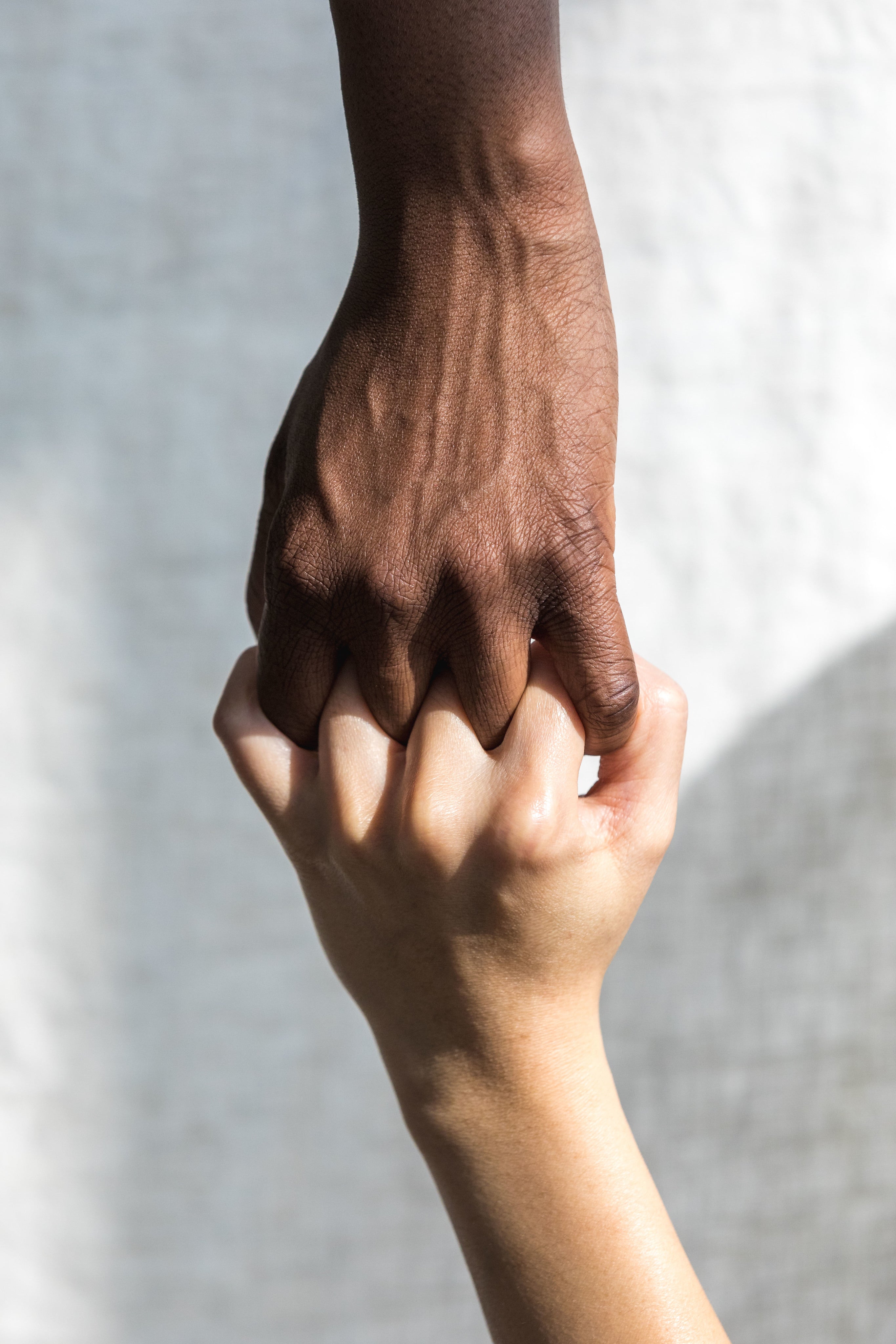 two-hands-grasping-each-other-in-solidarity.jpg